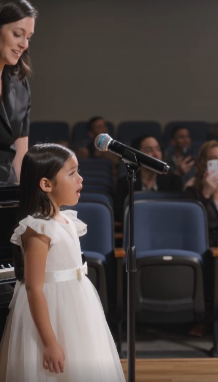 Little Girl Froze On Stage At The School Concert — Then The Auditorium Doors Opened